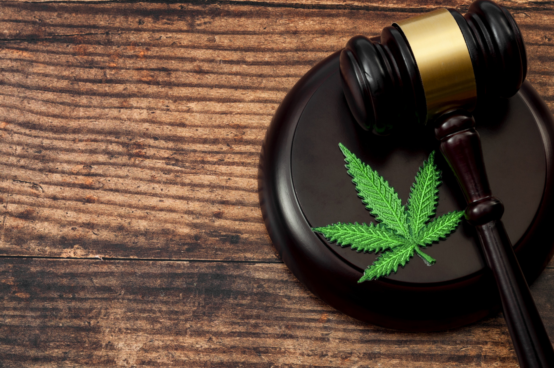 Marijuana leaf on top of a judge’s gavel